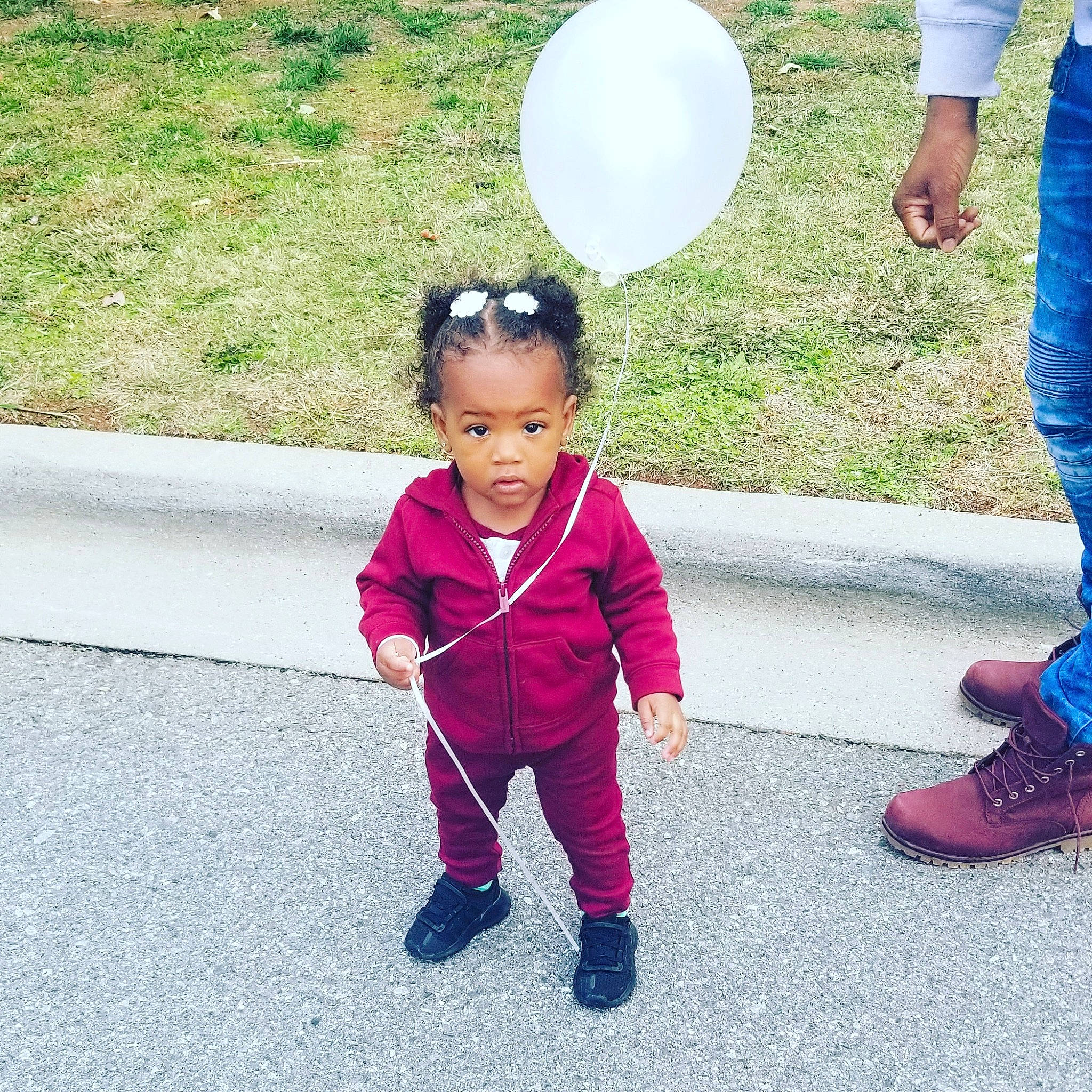 Arielle is registered to the contest to win money with this photo: child, footwear, grass, happy, leisure, people, person, play, recreation, shoe, smile, toddler, vacation, walking