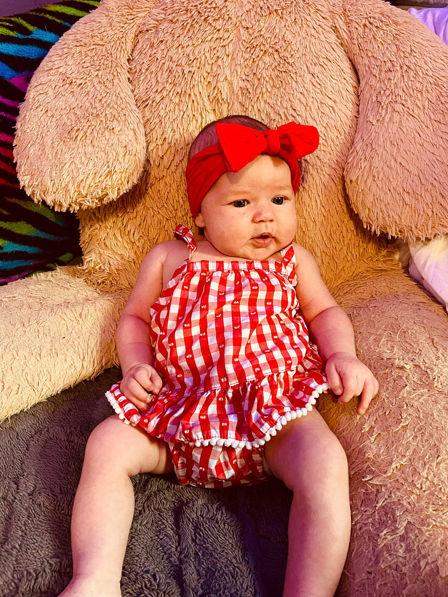 Ella Mae is registered to the contest to win money with this photo: baby, baby_toddler_clothing, cap, child, comfort, dress, eye, happy, hat, headgear, headwear, knit_cap, magenta, pattern, person, pink, product, skin, sleeve, sun_hat