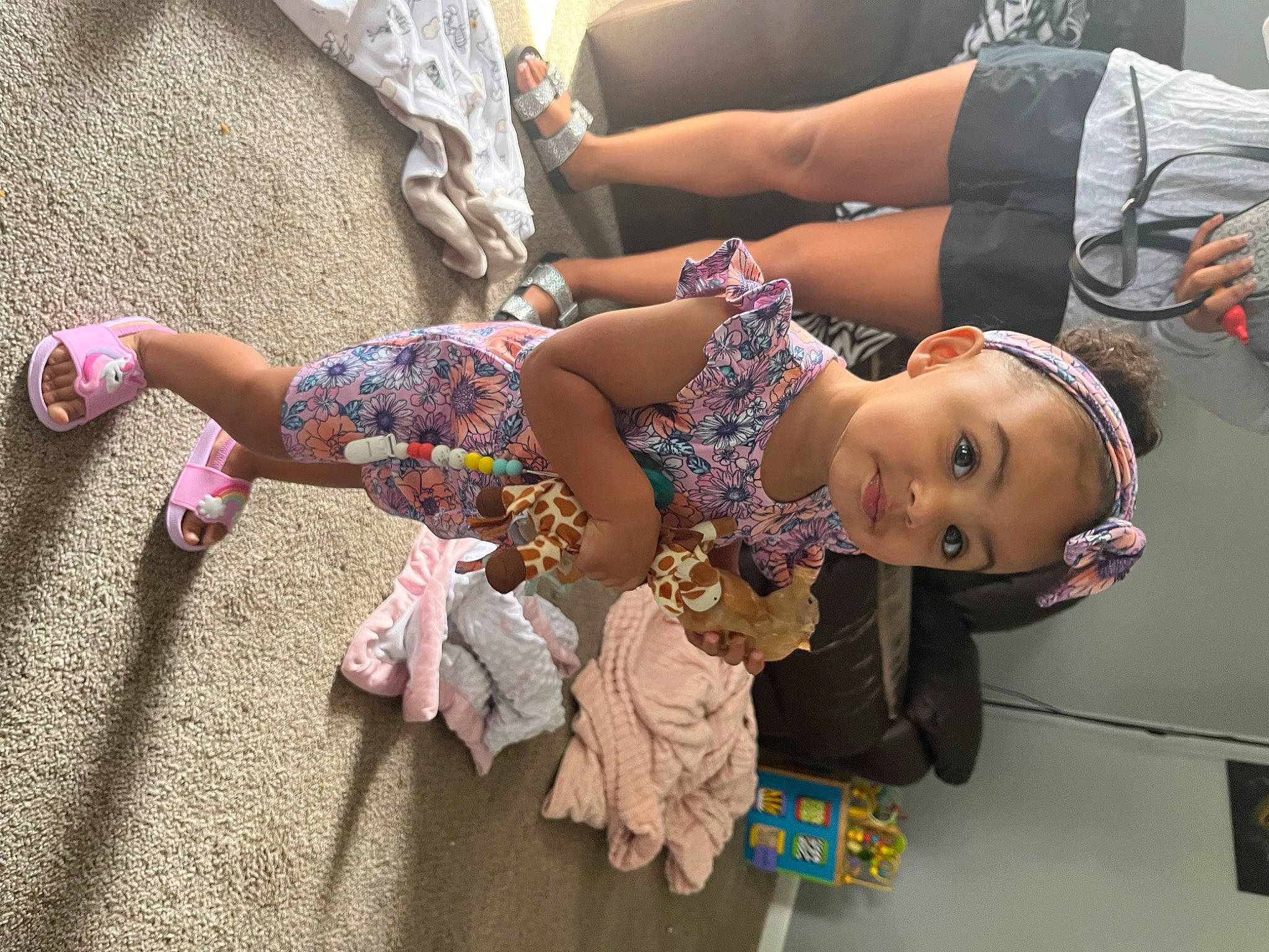 Jadyn is registered to the contest to win money with this photo: arm, child, dress, event, eyewear, fashion_design, footwear, fun, hand, happy, human_leg, joint, leisure, person, pink, sandal, skin, thigh, toddler, tree