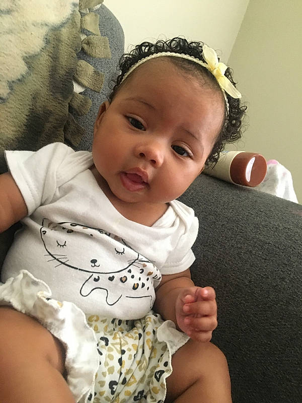 Mylah joined the competition — help win amazing prizes! baby, baby_toddler_clothing, beauty, cheek, child, comfort, facial_expression, finger, fun, gesture, hairstyle, hand, happy, human, mammal, person, sitting, skin, sleeve, toddler