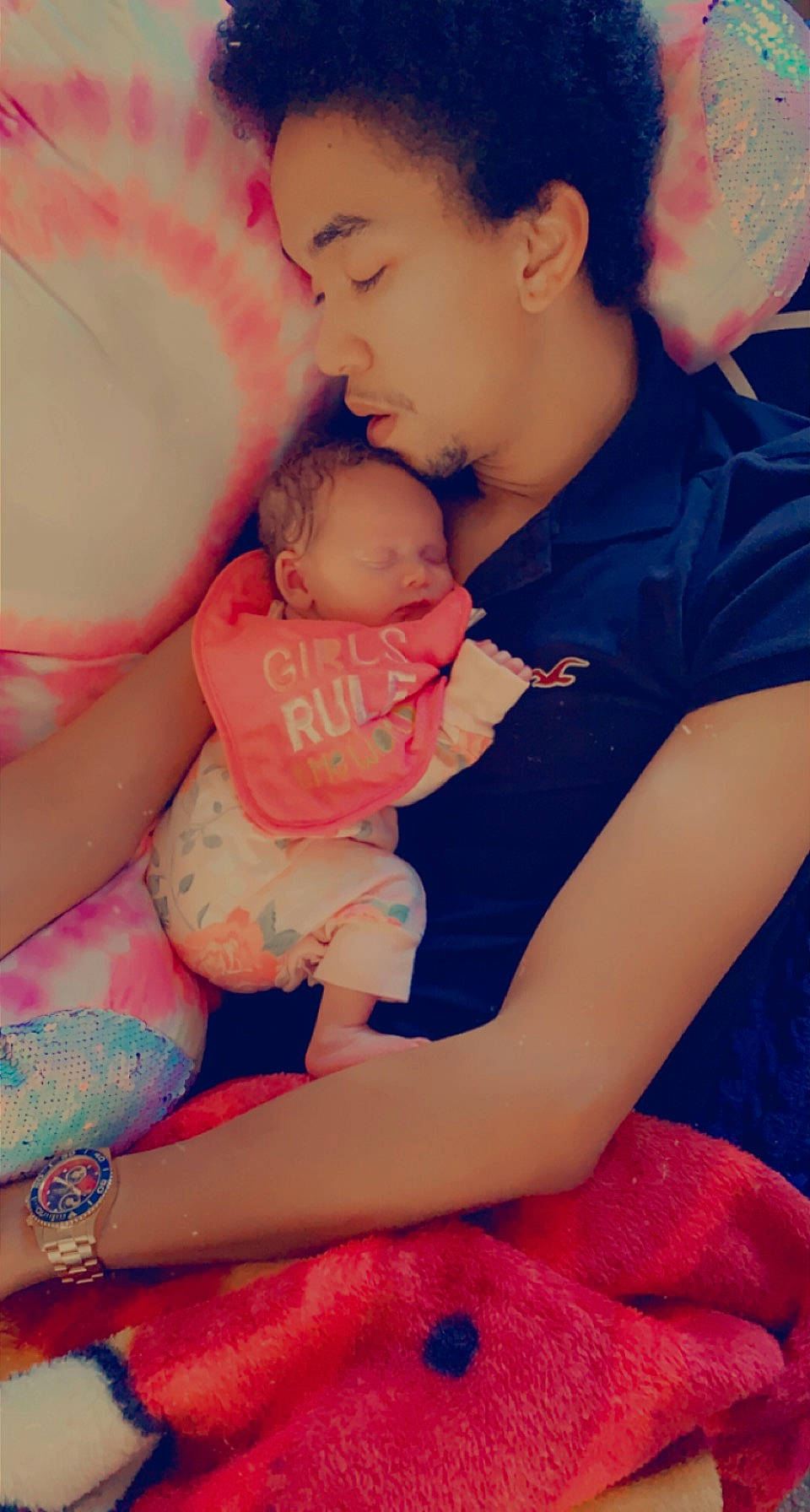 Rita is registered to the contest to win money with this photo: baby, child, finger, flash_photography, fun, gesture, happy, head, human_body, interaction, leg, mouth, orange, people, person, pink, red, shoulder, skin, stomach