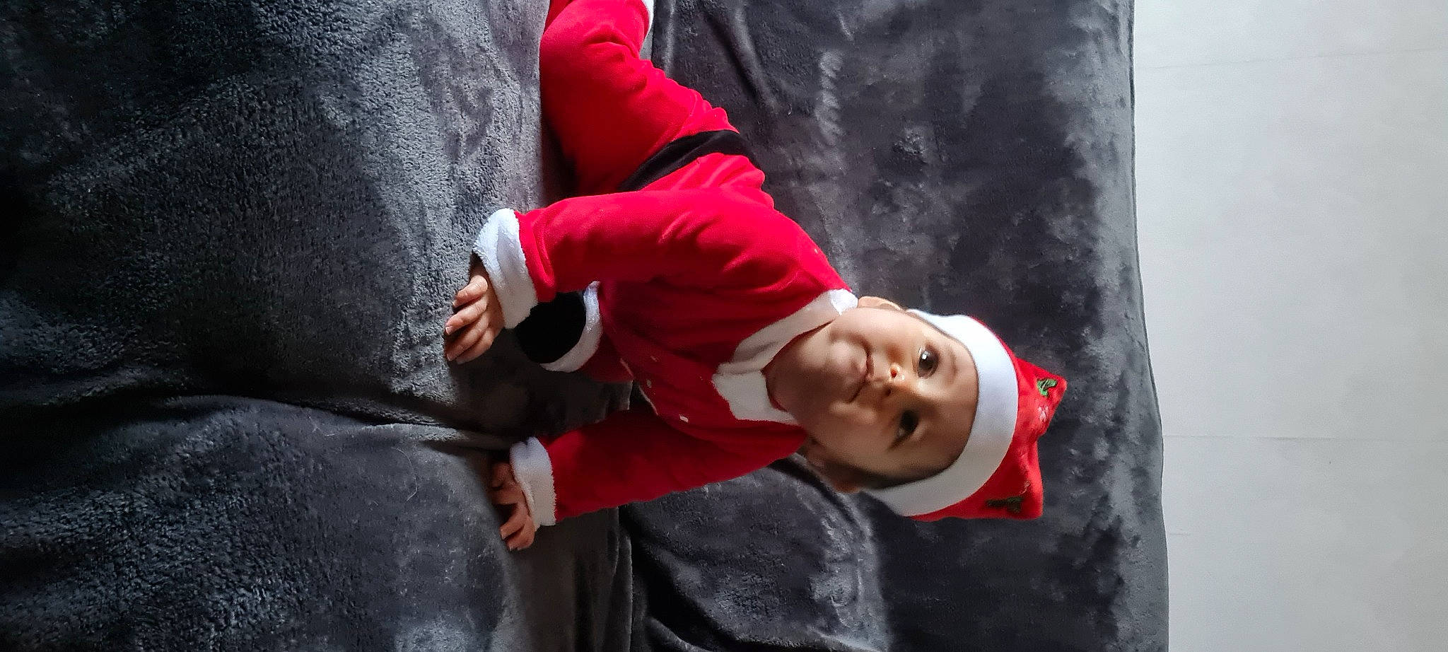 Alicia participe au concours pour gagner de l'argent avec cette photo : adventure, carmine, child, fun, fur, gesture, grass, headwear, hood, hoodie, leisure, magenta, outerwear, person, plant, portrait_photography, sitting, sleeve, tree, winter