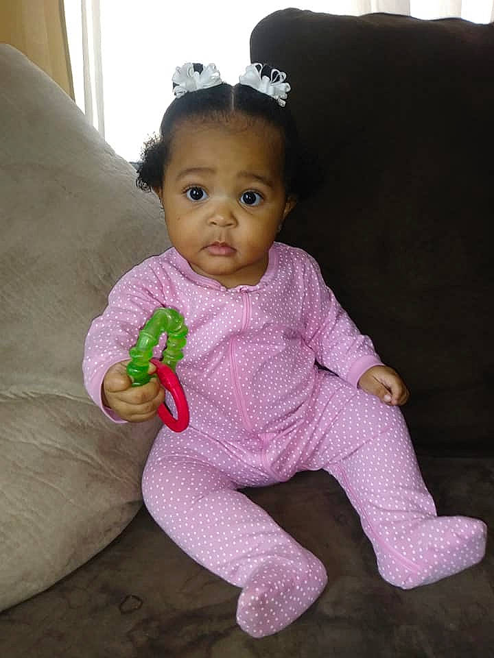 Emiyah is registered to the contest to win money with this photo: baby, baby_toddler_clothing, cheek, child, head, lip, person, pink, sitting, skin, smile, textile, toddler