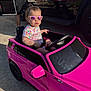 adult, casual, child, concrete, controller, drive, garage, outdoor, pink_car, play, reflection, shorts, sidewalk, summer, sunglasses, sunlight, toddler, toy_car, tshirt, vehicle
