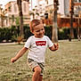 Ethan participe au concours pour gagner de l'argent avec cette photo : child, toddler, smiling, outdoor, grass, shorts, tshirt, levis, walking, greenery, palm_trees, daylight, playful, happy, boy, summer, nature, casual_clothing, young_child, park