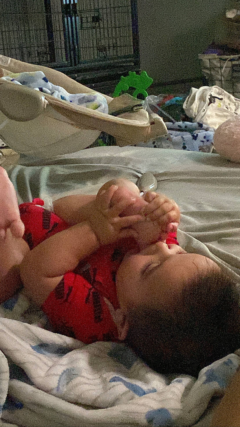 Daniel is registered to the contest to win money with this photo: abdomen, baby, barechested, bedtime, chest, child, comfort, event, flesh, foot, fun, grass, linens, mouth, muscle, person, room, sand, textile, toddler