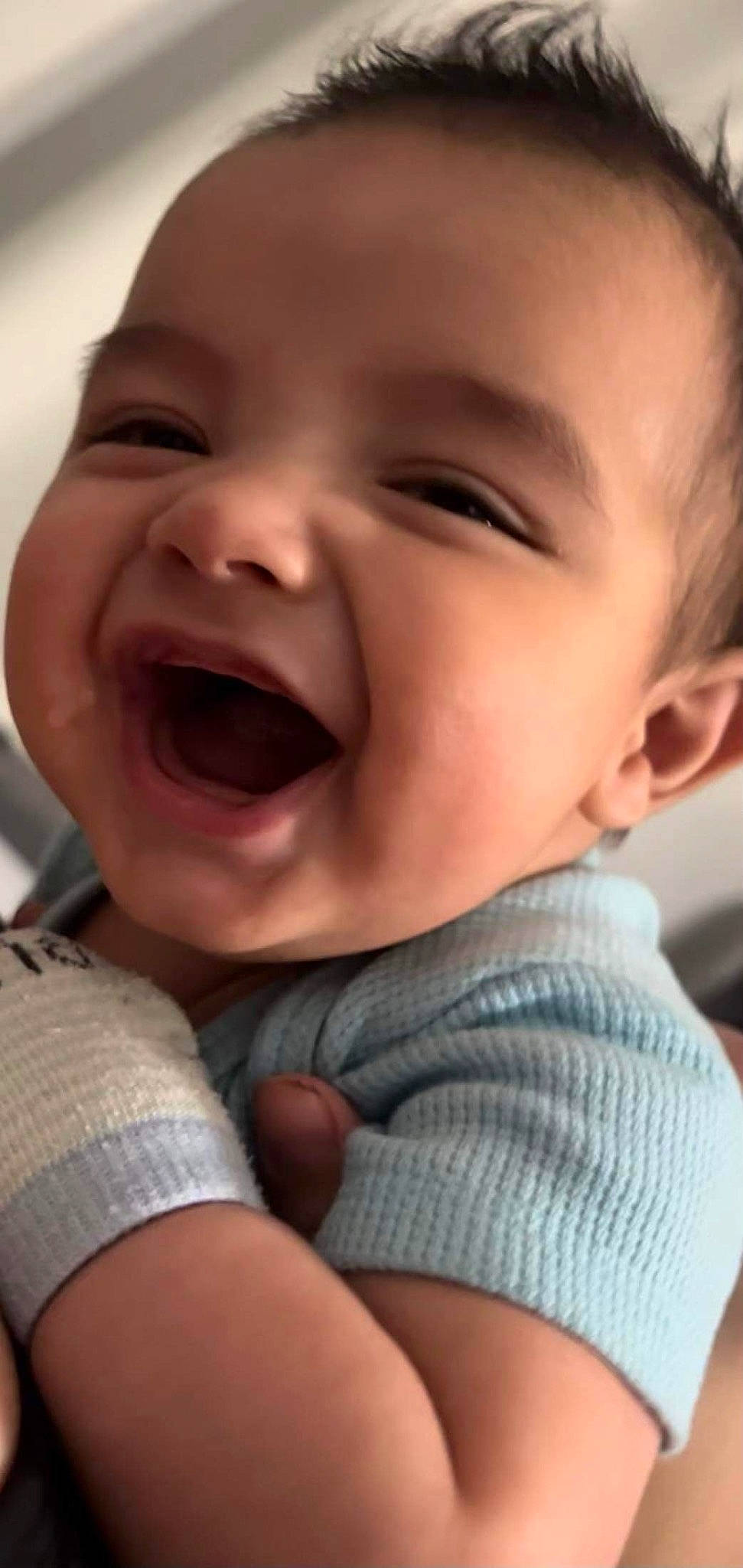 Daniel is registered to the contest to win money with this photo: baby, baby_toddler_clothing, cheek, chin, comfort, eyebrow, facial_expression, finger, gesture, happy, iris, lip, mouth, neck, nose, person, skin, sleeve, smile, toddler