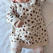 Iris participe au concours pour gagner de l'argent avec cette photo : baby, infant, child, leopard_print, headband, bow, socks, shoes, cute, smiling, happy, stretching, blanket, patterned_clothing, lying_down, indoor, soft_texture, adorable, fashion, portrait