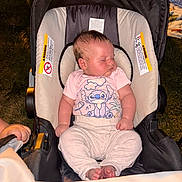 Alanni is registered to the contest to win money with this photo: baby, sleeping, car_seat, pink_shirt, outdoor, night, infant, cute, child, peaceful, cartoon_print, small_toddler, clothing, feet, head, person, seat, relaxing, young, childcare