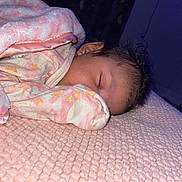 Paisley is registered to the contest to win money with this photo: baby, bed, bedroom, blanket, bodypart, bonnet, clothing, crib, cushion, face, finger, furniture, glove, hand, hat, head, homedecor, indoors, infantbed, newborn