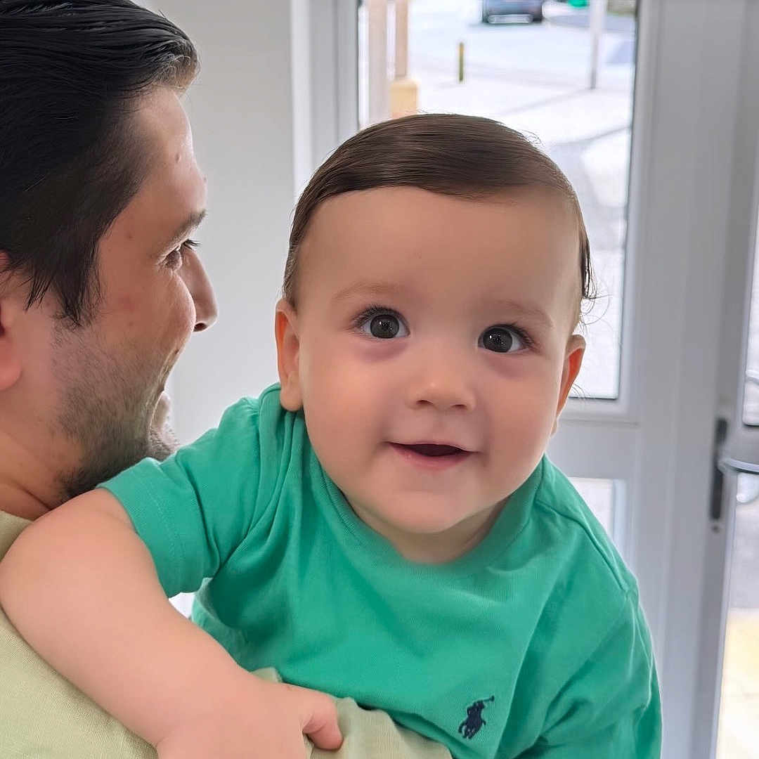 Albion is registered to the contest to win money with this photo: accessories, adult, baby, bracelet, clothing, door, face, happy, head, hugging, indoors, jewelry, male, man, people, person, photography, portrait, smile, t_shirt