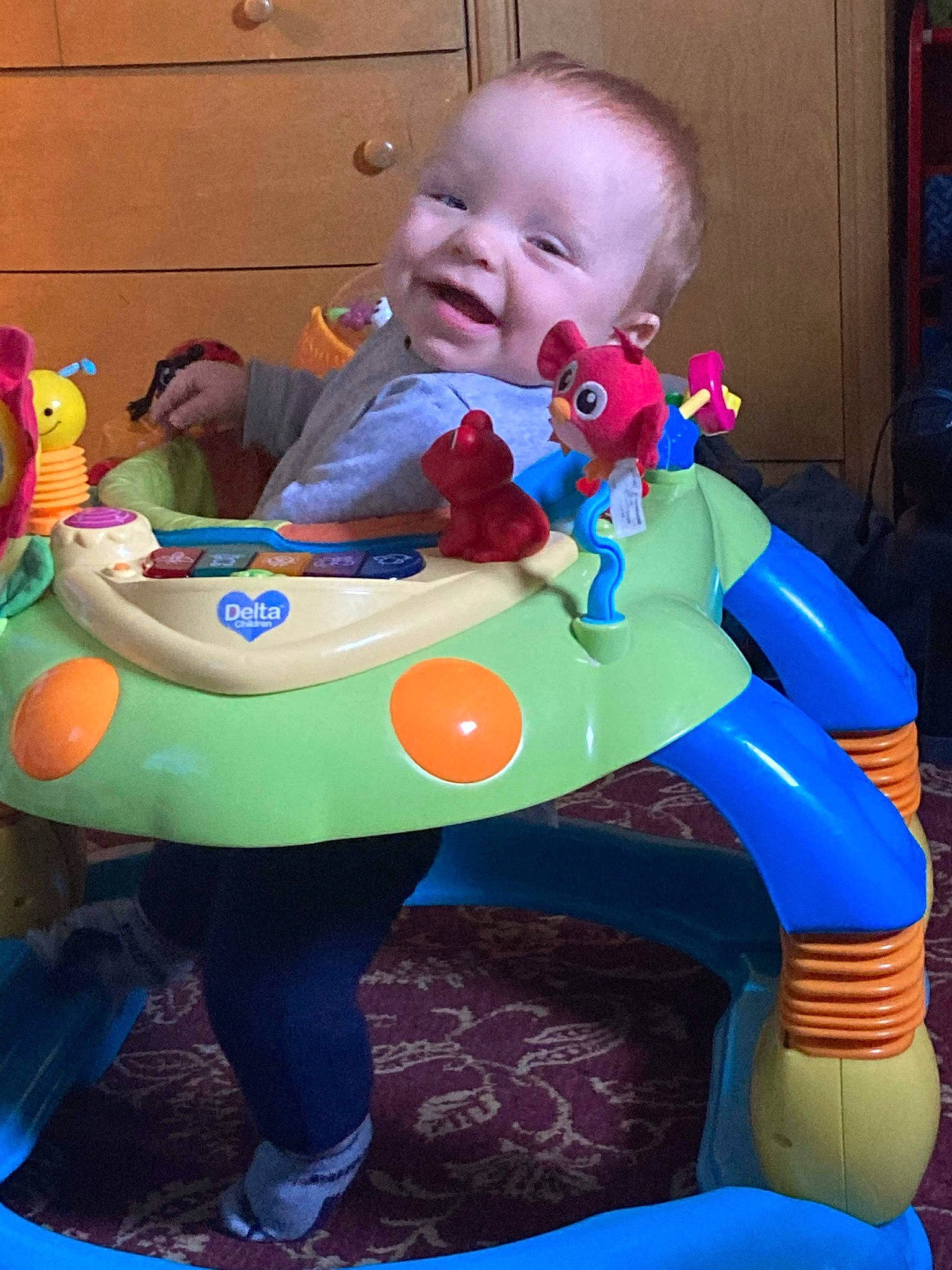 Dallen is registered to the contest to win money with this photo: baby, baby_playing_with_toys, baby_products, baby_toddler_clothing, blue, child, comfort, electric_blue, fun, green, happy, head, leisure, person, product, purple, sitting, smile, snapshot, toddler