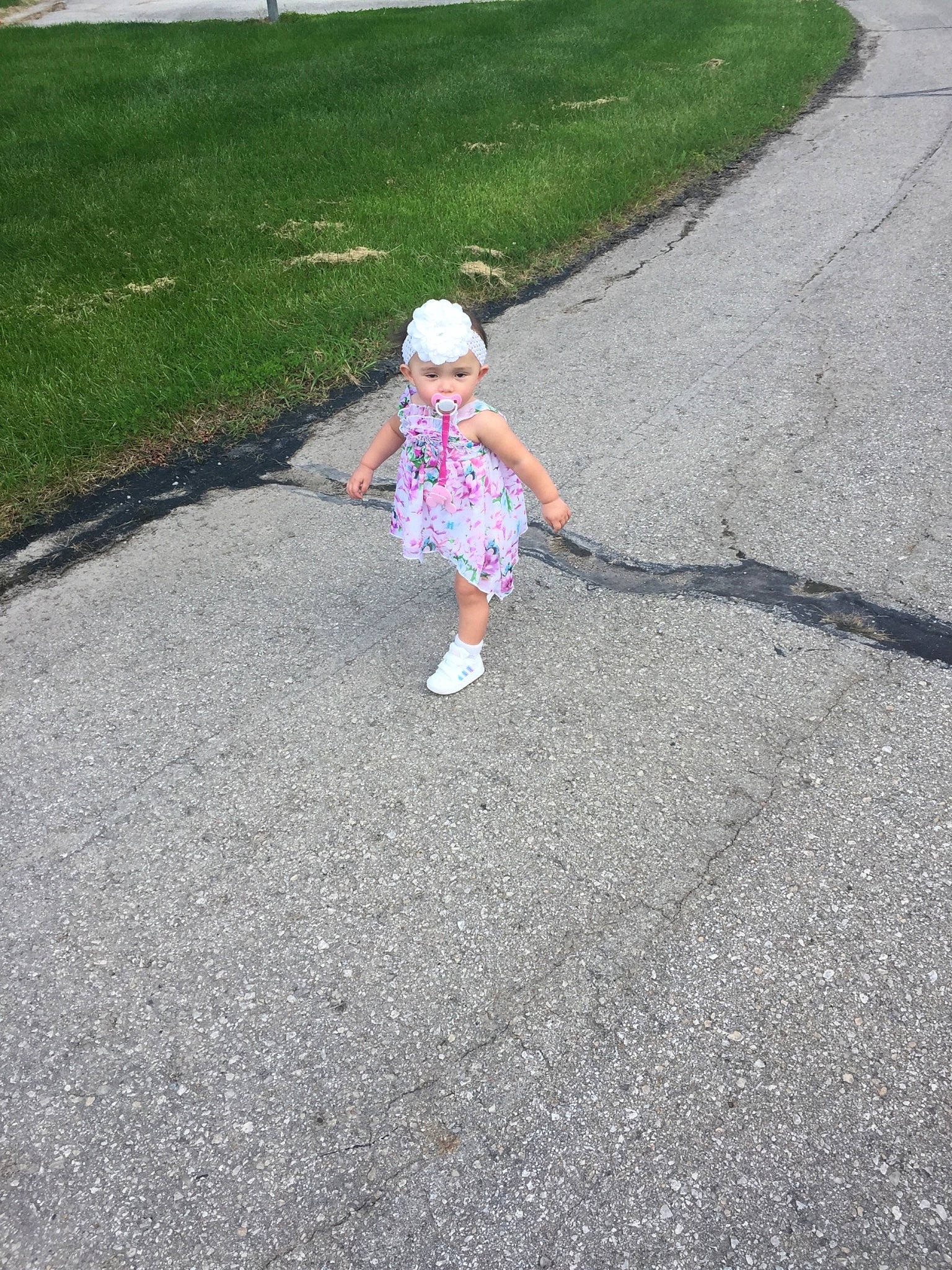 Sofia is registered to the contest to win money with this photo: asphalt, child, driveway, fun, grass, lawn, leaf, person, plant, play, recreation, road, road_surface, sidewalk, toddler, yard