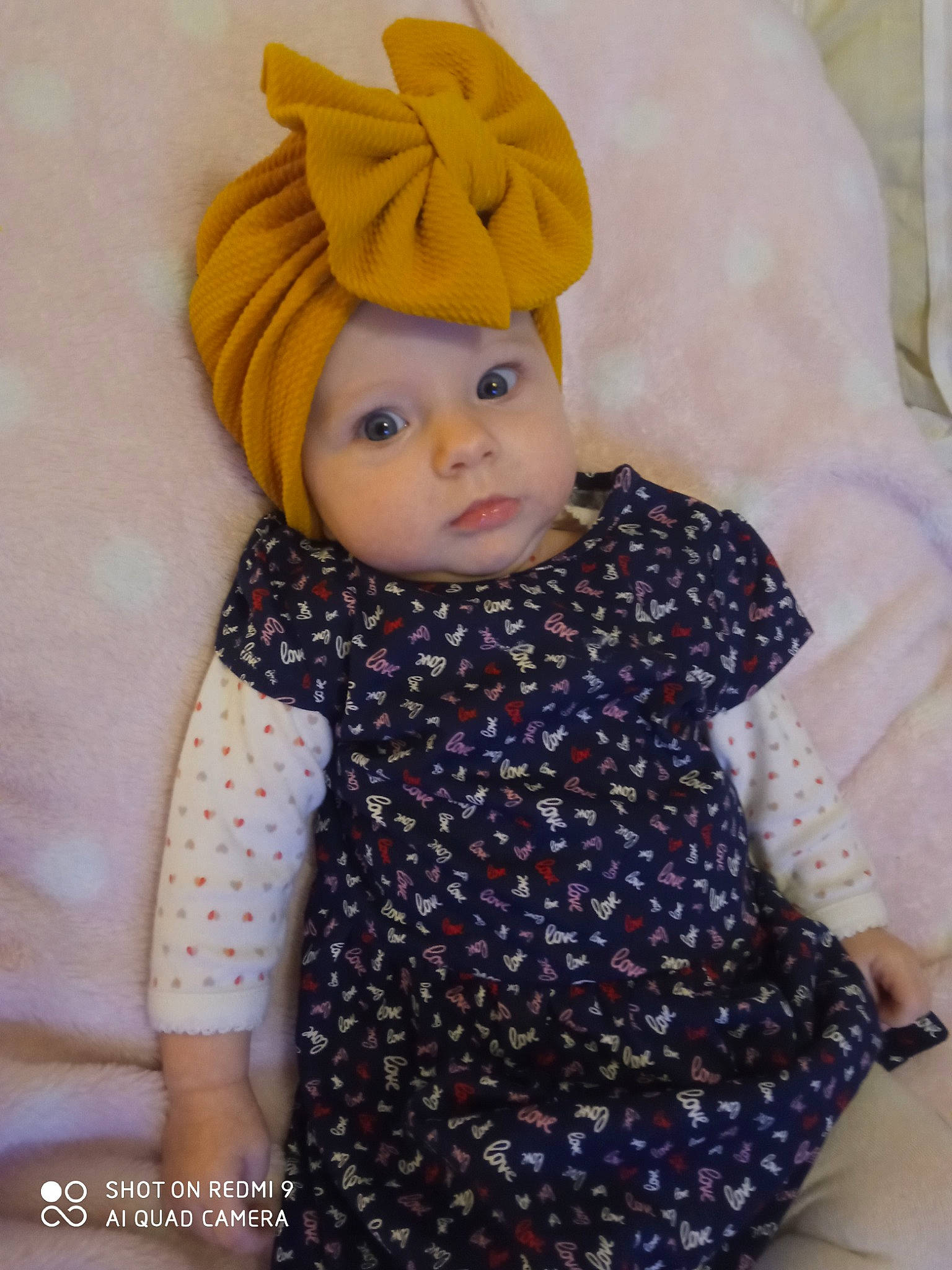 Jade a rejoint le concours — aidez-le/la à gagner de superbes lots ! baby, baby_toddler_clothing, blond, cap, doll, eyelash, fashion_accessory, fur, headpiece, headwear, iris, knit_cap, lip, pattern, person, pink, purple, sleeve, textile, toddler