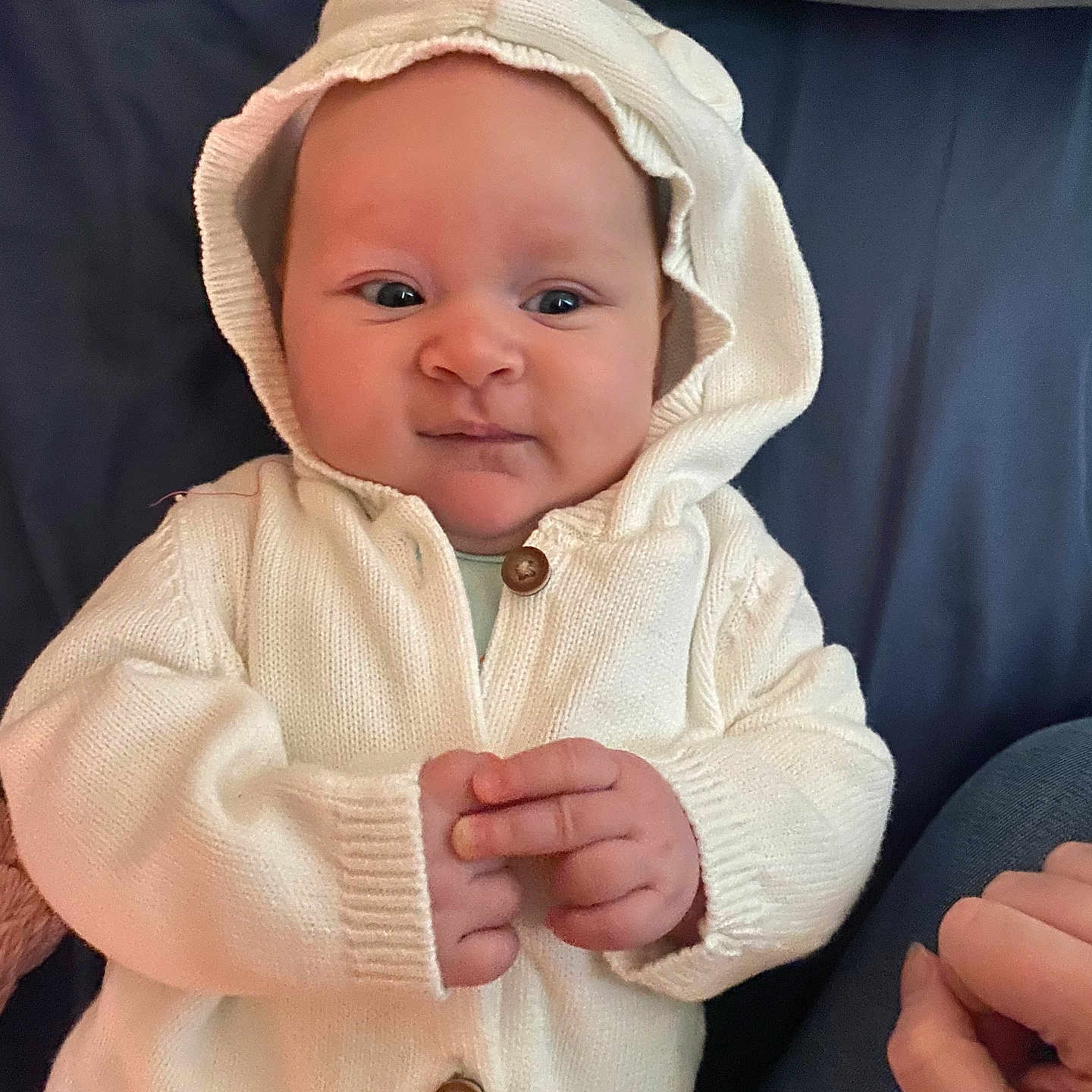 Maya joined the competition — help win amazing prizes! baby, babylaughing, bonnet, clothing, coat, face, happy, hat, head, hood, jacket, knitwear, person, photography, portrait, smile, sweater
