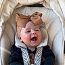 Anaya participe au concours pour gagner de l'argent avec cette photo : baby, black_sleeves, bow, car_seat, child, closeup, clothing, cute, fabric, happy, headband, indoors, infant, laughing, person, portrait, seat, smiling, straps, young