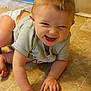 baby, child, crawling, smiling, happy, floor, tile, indoor, person, cute, infant, hands, diaper, green_shirt, skin, young, joyful, toddler, face, head