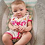 Rayven joined the competition — help win amazing prizes! baby, infant, child, cushion, seat, clothing, onesie, paint, name, pink, skin, hands, legs, face, expression, indoor, striped, pattern, cute, portrait