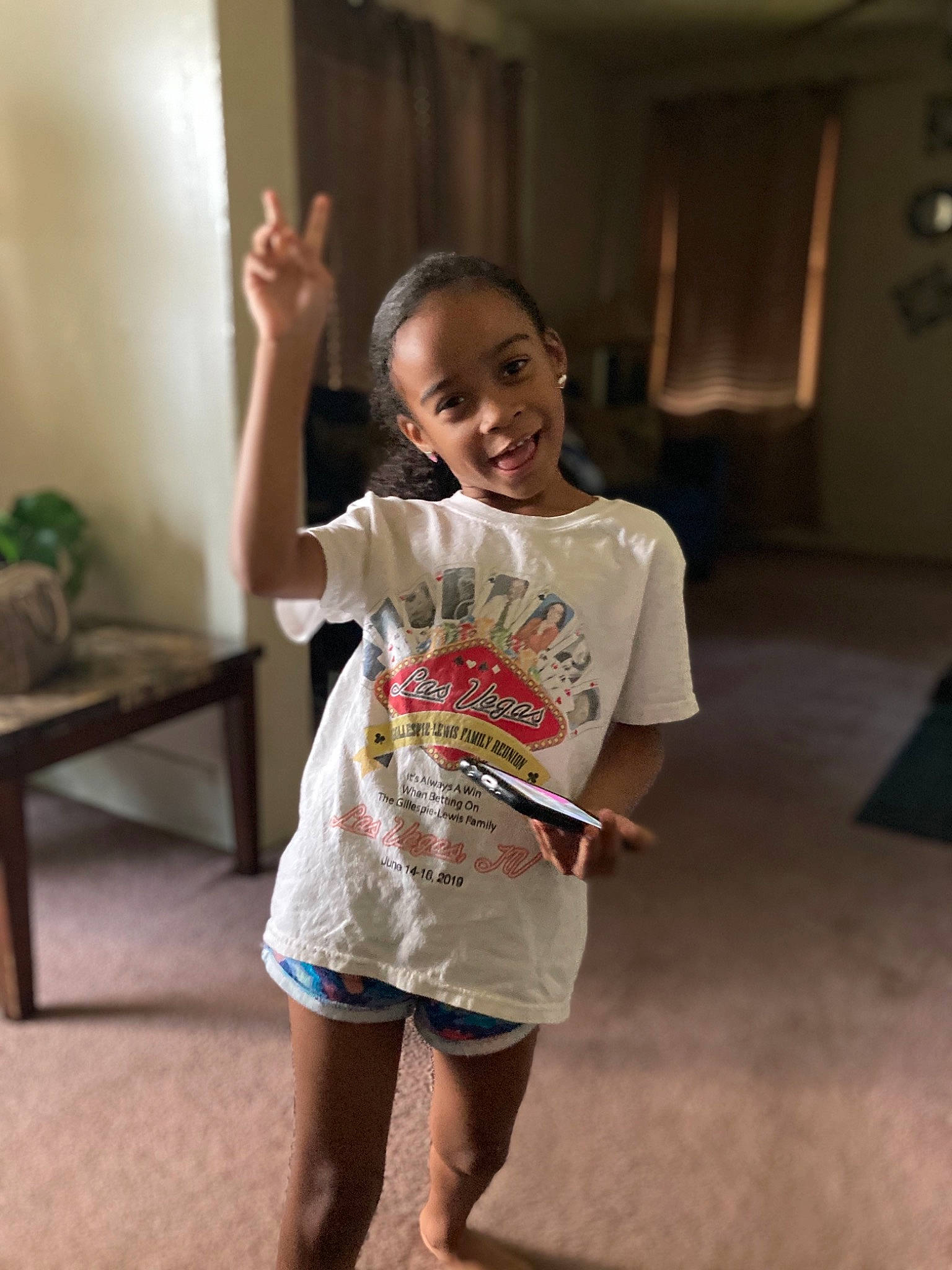 Samara is registered to the contest to win money with this photo: child, fun, happy, head, joint, joy, person, play, room, shoulder, skin, smile, standing, t_shirt, toddler, vacation