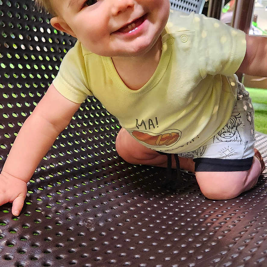 Leo joined the competition — help win amazing prizes! baby, clothing, crawling, face, grass, head, nature, outdoorplayarea, outdoors, park, person, photography, plant, playarea, portrait, shorts, sitting, slide, t_shirt, toy