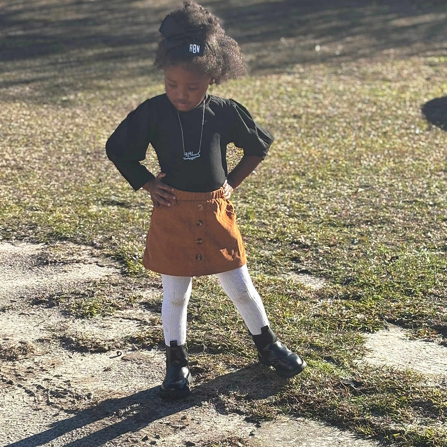 Aamori is registered to the contest to win money with this photo: accessories, child, clothing, face, female, footwear, girl, grass, hair, head, jewelry, necklace, outdoors, person, photography, plant, portrait, shoe, skirt, sleeve