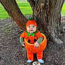 Corey joined the competition — help win amazing prizes! baby, infant, child, pumpkin_costume, halloween, orange, green, hat, plush_pumpkin, milestone, five_months, tree, park, outdoor, grass, mulch, autumn, sitting, portrait, smiling