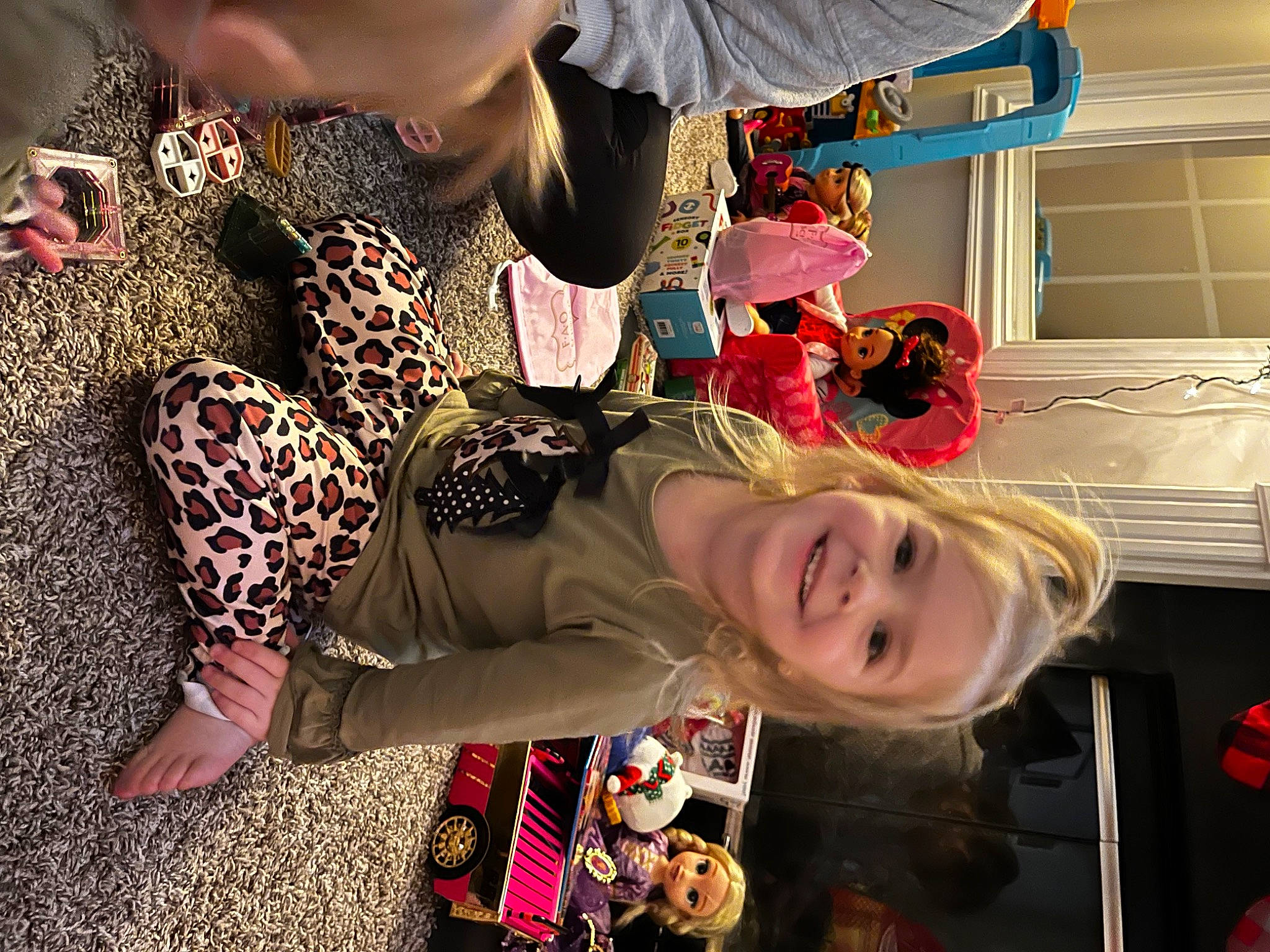 Karsyn is registered to the contest to win money with this photo: child, eyewear, fun, happy, headwear, human_leg, joy, pattern, person, room, smile, thigh, toddler, tree, visual_arts