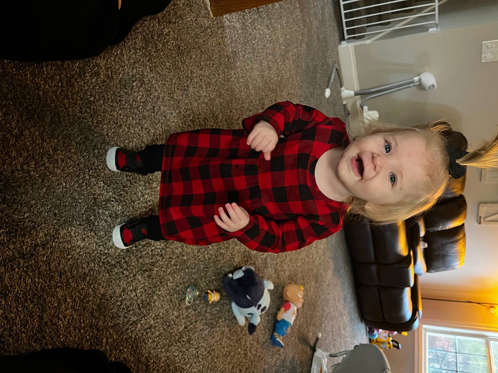 Oaklynn is registered to the contest to win money with this photo: baby, carmine, child, christmas, costume, flooring, fun, holiday, human_leg, pattern, person, plaid, room, sitting, smile, sock, tartan, toddler, toy, tree