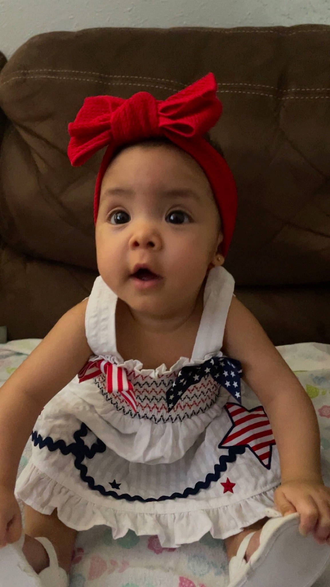 Kailani is registered to the contest to win money with this photo: baby, baby_toddler_clothing, cheek, chin, dress, eye, face, happy, head, headwear, iris, lip, neck, organ, outerwear, person, pink, skin, sleeve, smile