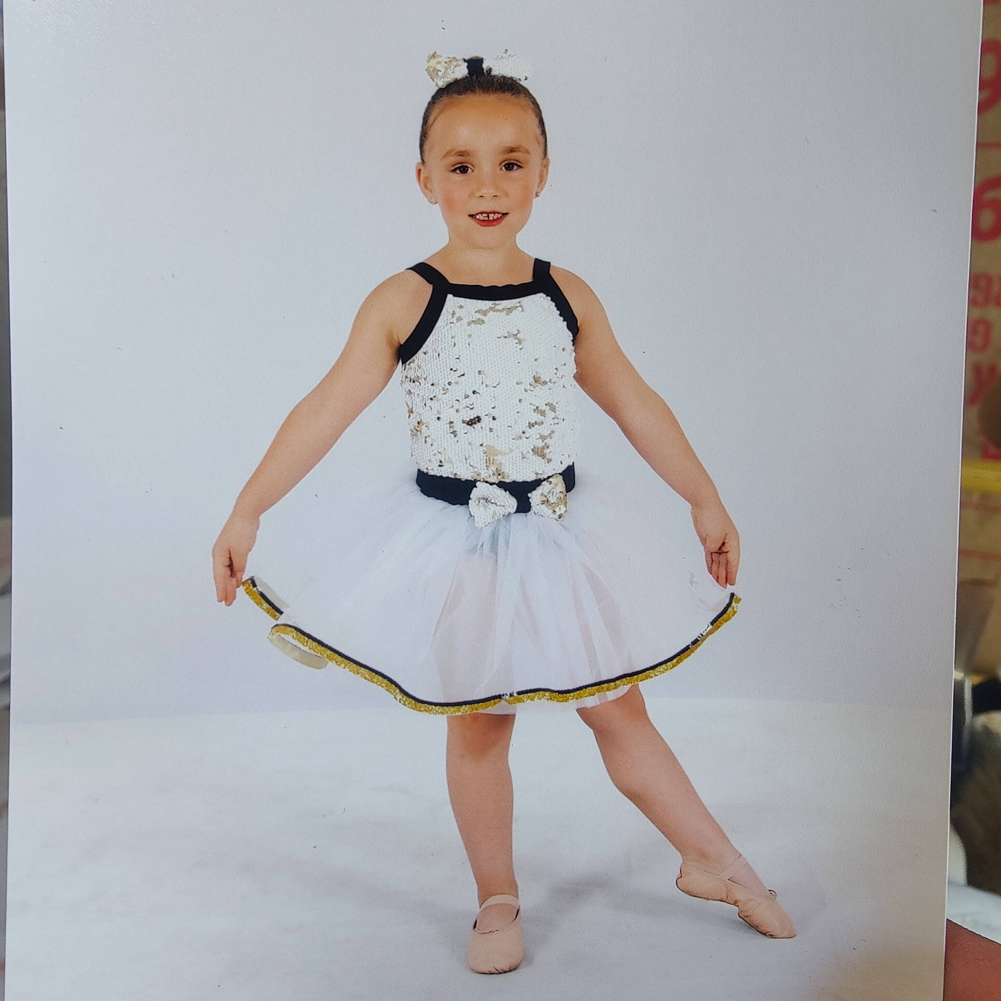 Jaemison is registered to the contest to win money with this photo: arm, baby_toddler_clothing, dance, day_dress, dress, face, fashion_design, formal_wear, hair, happy, human_body, joy, knee, neck, one_piece_garment, pattern, person, shoulder, sleeve, smile