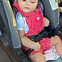 baby, child, car_seat, red_overalls, white_shirt, bracelet, ankle_bracelet, safety_belt, seat_belt, car, infant, cute, portrait, indoors, seat, young_child, person, clothing, hand, foot