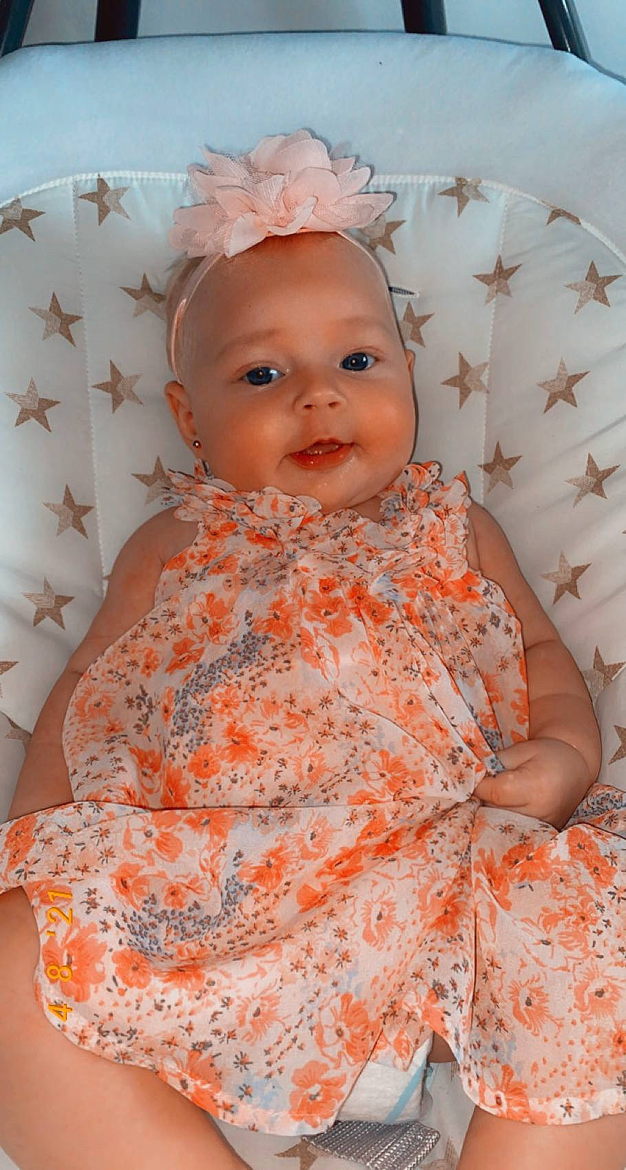 Wolfie participe au concours pour gagner de l'argent avec cette photo : baby, baby_toddler_clothing, cheek, child, day_dress, dress, eye, face, happy, headgear, iris, lip, one_piece_garment, orange, pattern, person, pink, skin, sleeve, textile