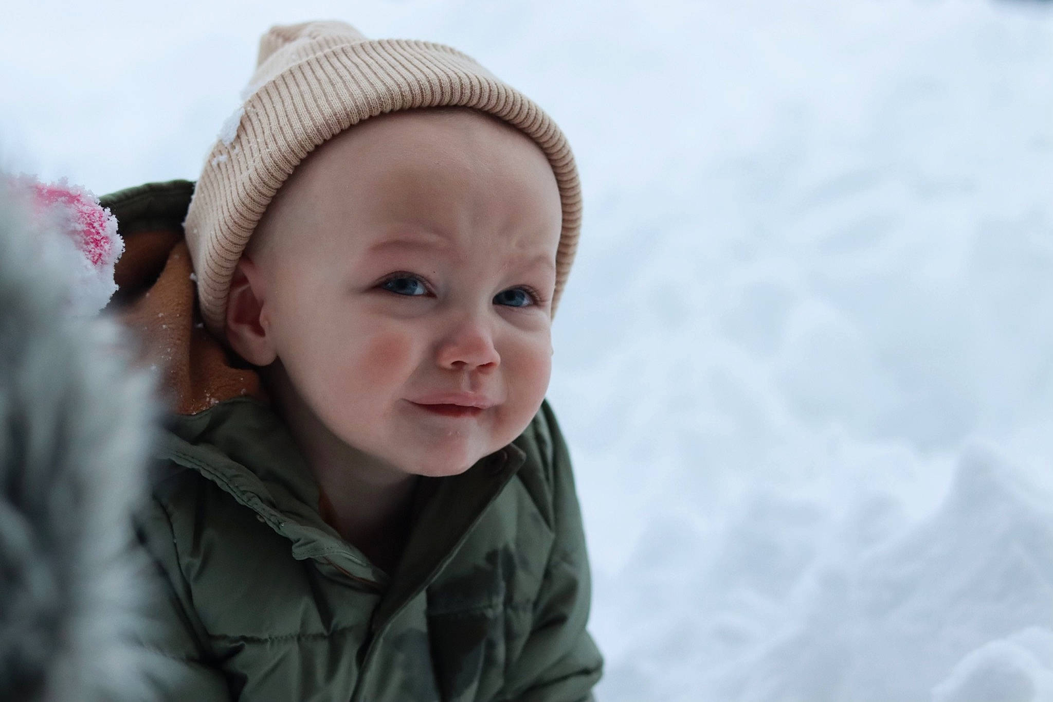 Ace is registered to the contest to win money with this photo: baby, beanie, cap, cheek, child, eyebrow, flash_photography, freezing, fun, happy, headwear, ice_cap, knit_cap, lip, nose, person, skin, sky, smile, snow