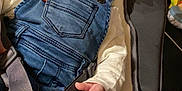 Swann a rejoint le concours — aidez-le/la à gagner de superbes lots ! baby, child, denim_overalls, smiling, seat, straps, white_shirt, indoor, cozy, cute, infant, happy, clothing, yellow_socks, baby_seat, portrait, young_child, candid, comfort, closeup
