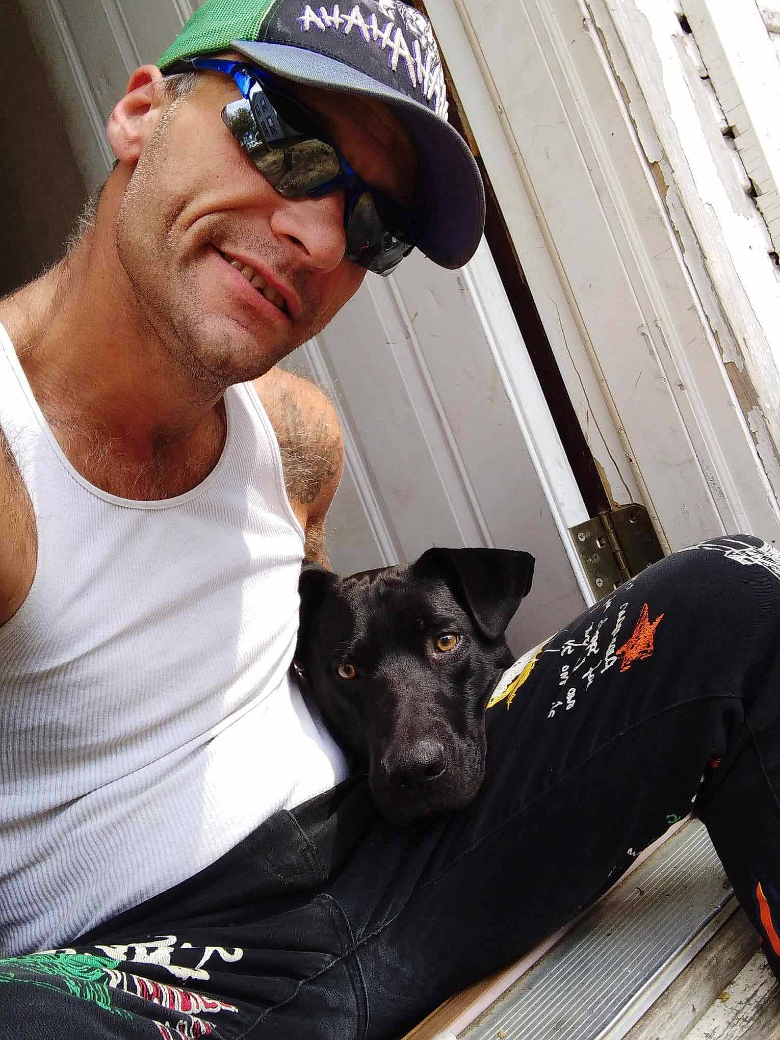 Smokey is registered to the contest to win money with this photo: baseball_cap, beard, cap, carnivore, chest, companion_dog, cool, dog, dog_breed, dog_collar, elbow, eyewear, goggles, hat, muscle, smile, snout, sunglasses, t_shirt, vision_care