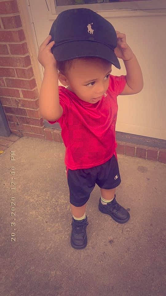 Legend is registered to the contest to win money with this photo: baseball_cap, cap, child, cool, footwear, hat, headgear, person, play, shoe, sleeve, standing, t_shirt, toddler