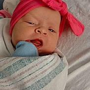 Riley joined the competition — help win amazing prizes! baby, newborn, infant, headband, bow, swaddle, blanket, hospital_bed, crib, mitten, mouth_open, face, eyes, nose, skin, portrait, cute, lying_down, soft_texture, pink