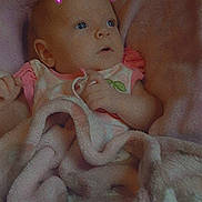 Riley joined the competition — help win amazing prizes! baby, blanket, pink, infant, face, expression, portrait, indoors, clothing, soft_texture, cute, child, neon, filter, head, lying_down, wrapped, hand, curious, cozy