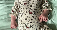 Isabelle is registered to the contest to win money with this photo: baby, sleeping, onesie, headband, hello_kitty, infant, cute, child, peaceful, soft_blanket, bed, clothing, patterned_clothes, portrait, indoors, newborn, resting, person, sleep, adorable