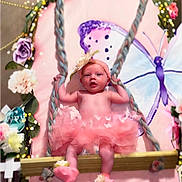 Isabelle joined the competition — help win amazing prizes! baby, tutu, pink, swing, flower, butterfly, rope, wood, cute, child, indoors, decoration, costume, portrait, smiling, headband, soft, happy, playful, person