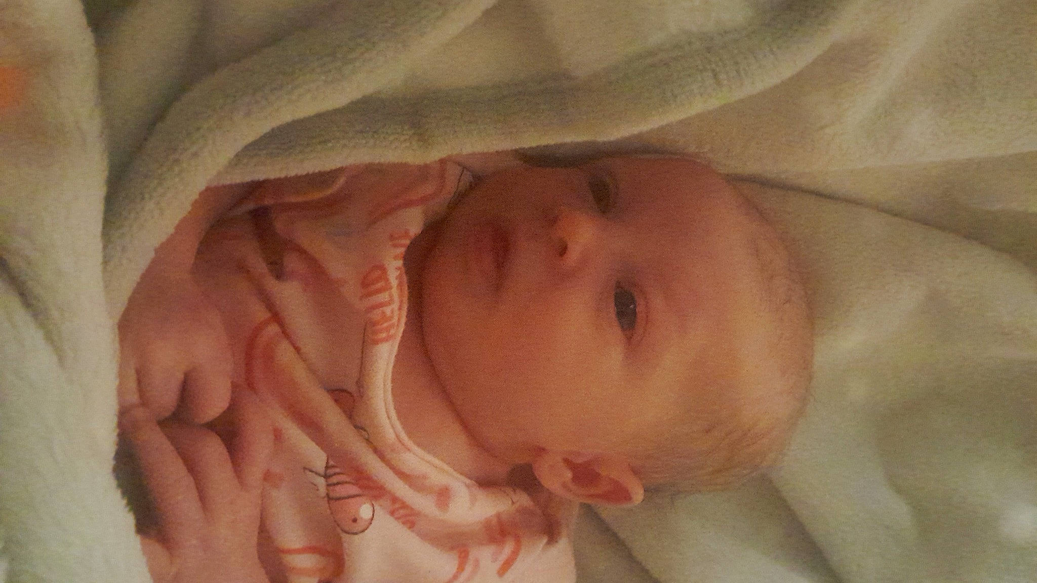 Pazlee is registered to the contest to win money with this photo: baby, cheek, comfort, ear, eye, eyebrow, face, finger, gesture, headgear, human_body, iris, lip, mammal, mouth, nose, person, pink, skin, thumb