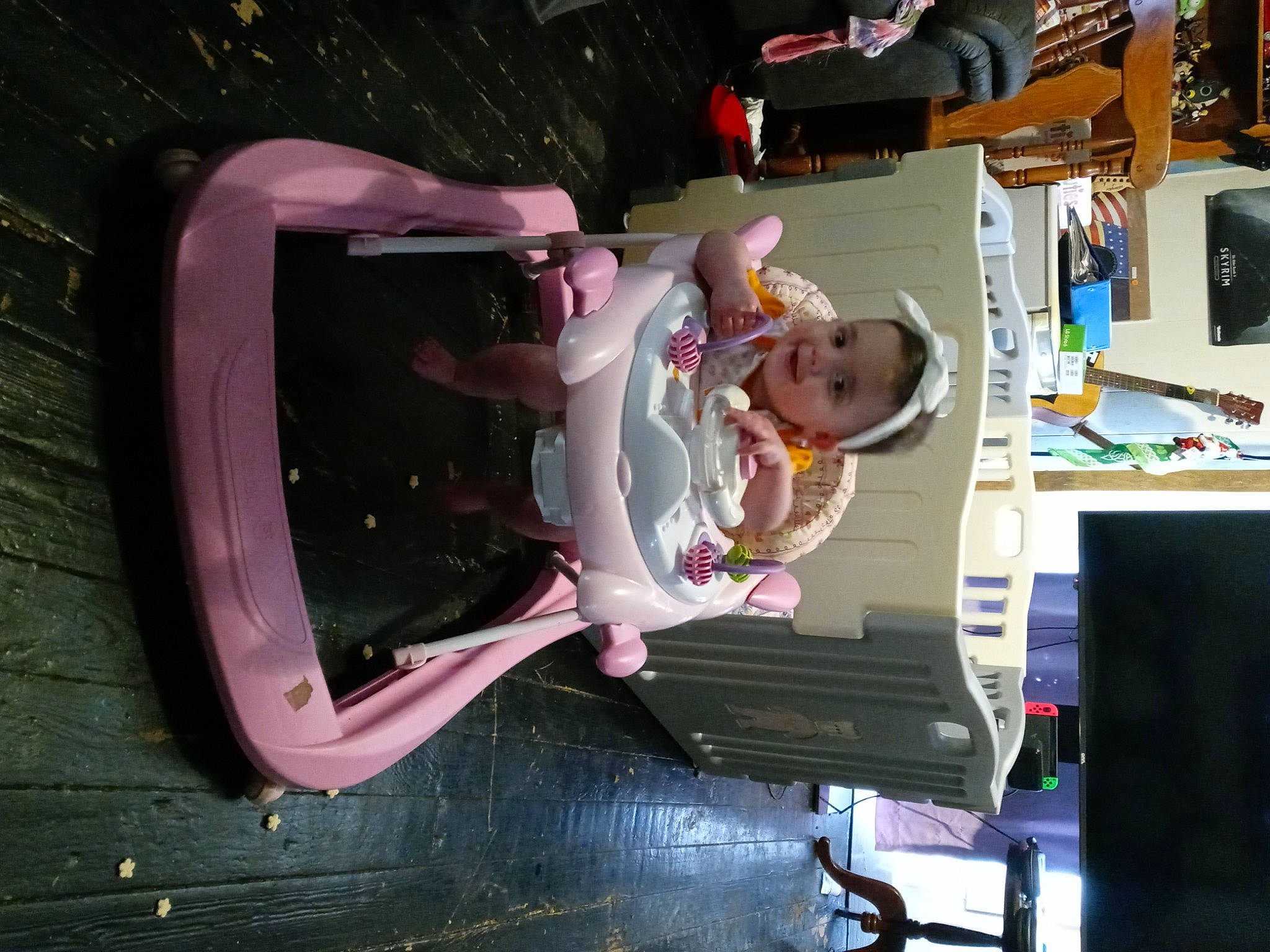 Ruby is registered to the contest to win money with this photo: automotive_design, baby, bumper, electronics, fun, machine, magenta, person, room, smile, toddler, toy, vehicle_door