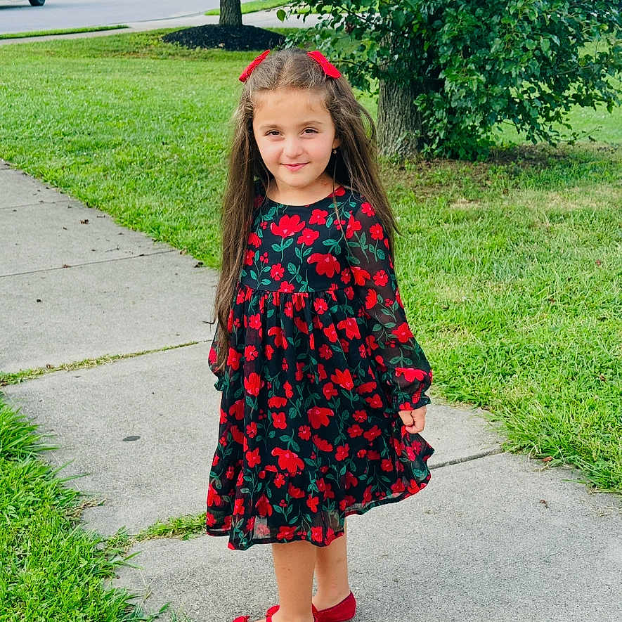 Ayten is registered to the contest to win money with this photo: casual, child, cute, daylight, dress, fashion, girl, grass, greenery, hair_bows, long_hair, nature, outdoor, person, portrait, red_shoes, sidewalk, smile, tree, young