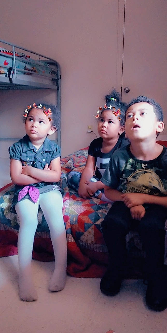 Nariah joined the competition — help win amazing prizes! child, costume, event, fashion_design, flash_photography, flesh, fun, headwear, human_leg, jewellery, knee, leg, necklace, person, personal_protective_equipment, room, shoulder, sitting, sock, t_shirt