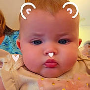 Memphis joined the competition — help win amazing prizes! baby, child, face, portrait, indoor, cute, pink_bow, digital_filter, hearts, bear_ears, chubby_cheeks, infant, person, clothing, soft_lighting, closeup, expression, blue_shirt, background, human