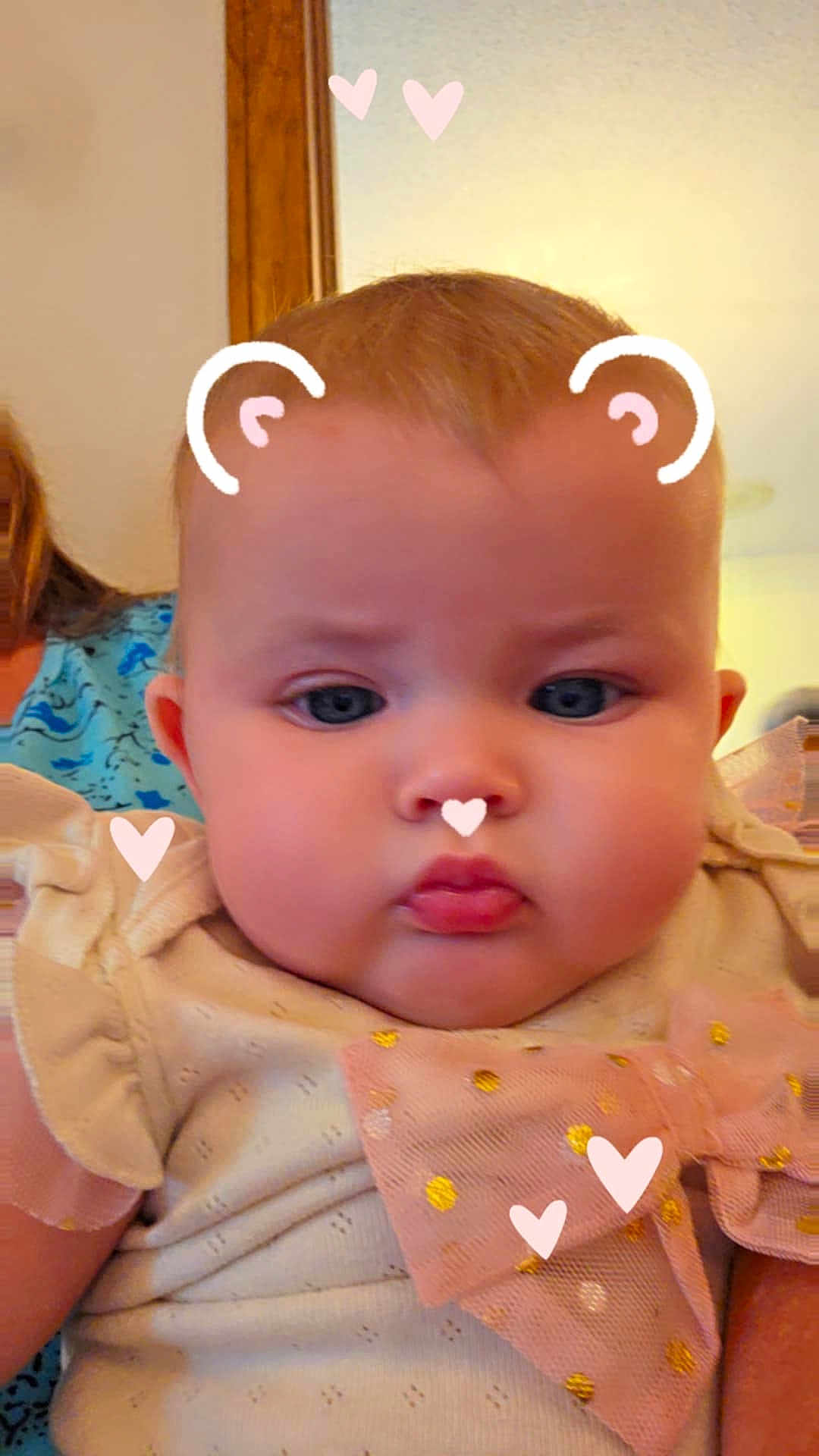 Memphis joined the competition — help win amazing prizes! baby, child, face, portrait, indoor, cute, pink_bow, digital_filter, hearts, bear_ears, chubby_cheeks, infant, person, clothing, soft_lighting, closeup, expression, blue_shirt, background, human