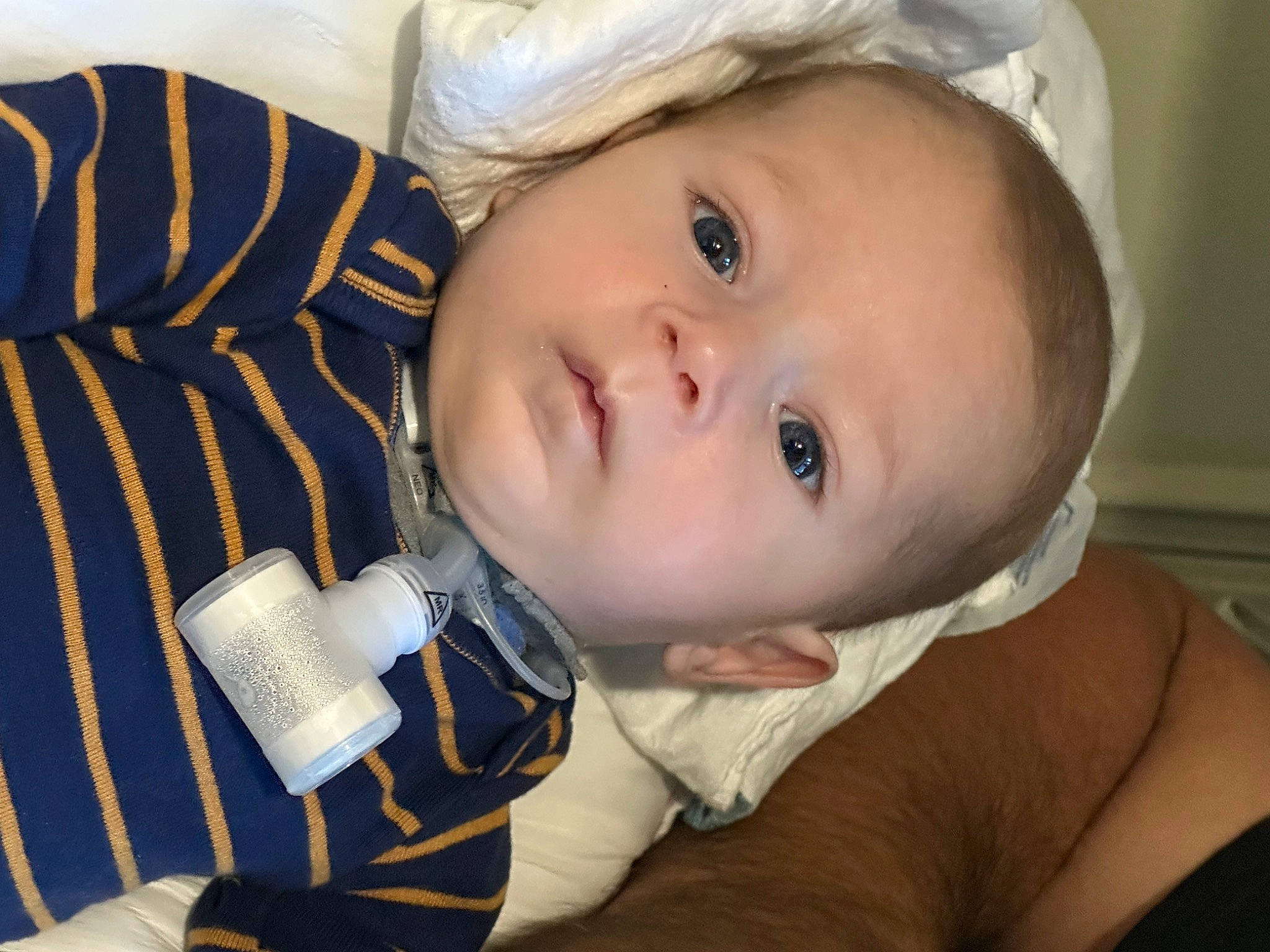 Jesús is registered to the contest to win money with this photo: baby, baby_toddler_clothing, cap, cheek, child, comfort, eyelash, fashion_accessory, flash_photography, happy, hat, no_expression, nose, person, portrait_photography, sitting, toddler