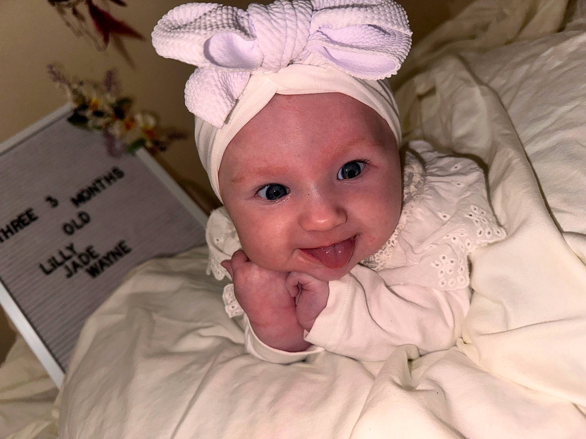 Lilly Jade joined the competition — help win amazing prizes! baby, bonnet, cheek, child, chin, comfort, event, eyebrow, face, fashion_accessory, hair_accessory, happy, headband, headpiece, headwear, laugh, linens, person, room, skin