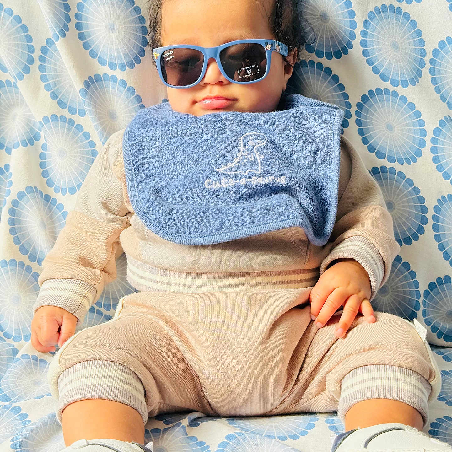 Censio joined the competition — help win amazing prizes! baby, beige, bib, blue, casual, child, clothing, cute, face, fashion, footwear, hand, head, indoor, infant, patterned_background, portrait, sitting, smile, sunglasses