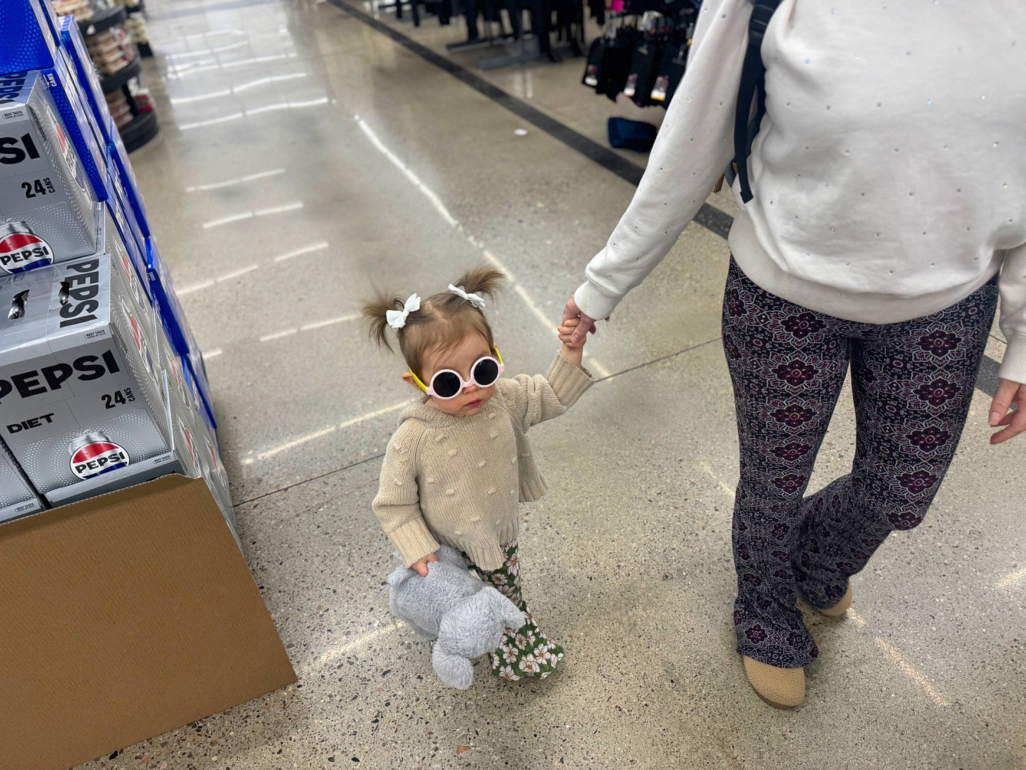 Aubriel is registered to the contest to win money with this photo: asphalt, bag, companion_dog, eyewear, flooring, fun, fur, gesture, human_leg, luggage_and_bags, pedestrian, person, road, road_surface, sidewalk, snapshot, standing, sunglasses, toy, travel